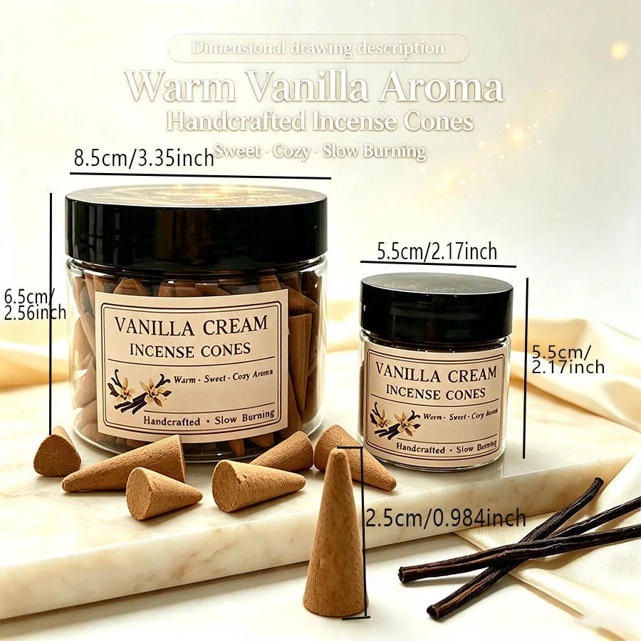 Two jars of vanilla cream incense cones with cones and vanilla pods on a wooden board